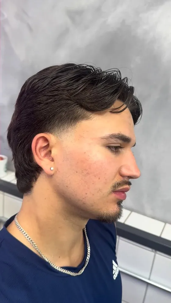 A clean taper fade finished at The Finery