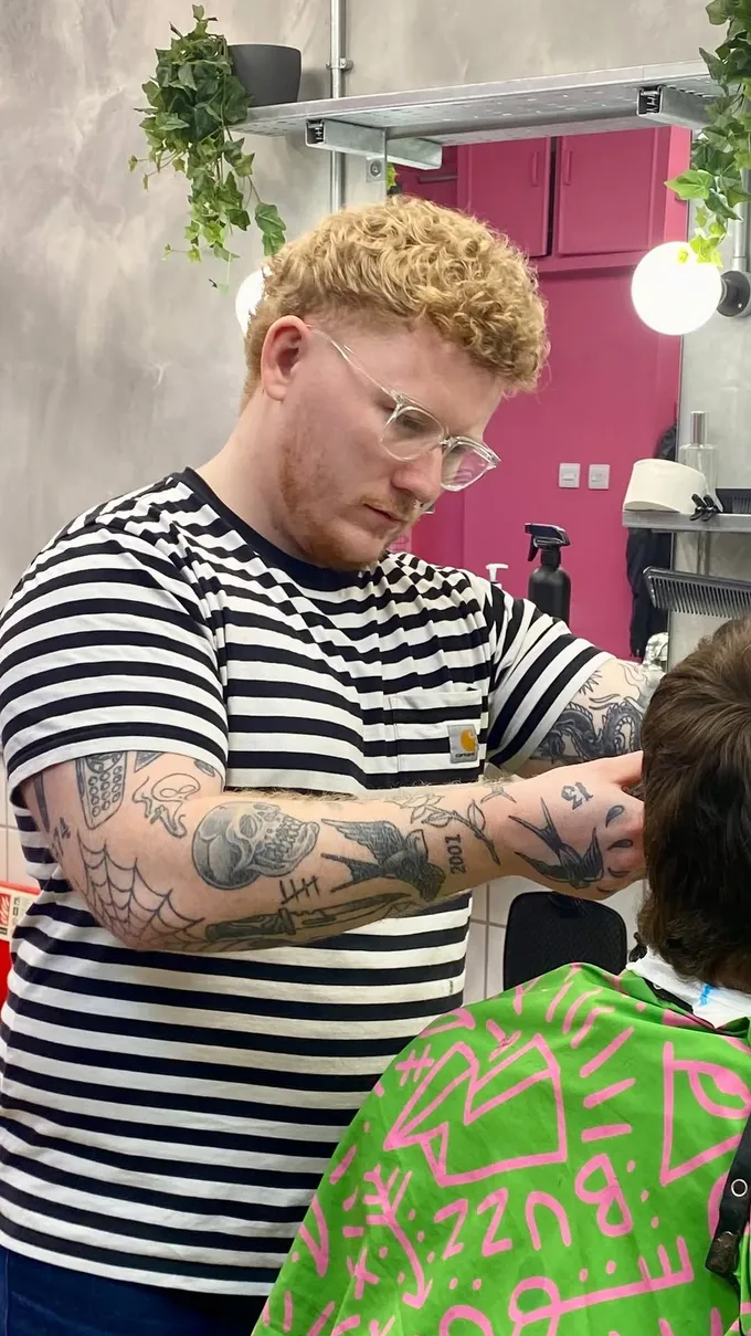 A Finery barber at work, mid-cut