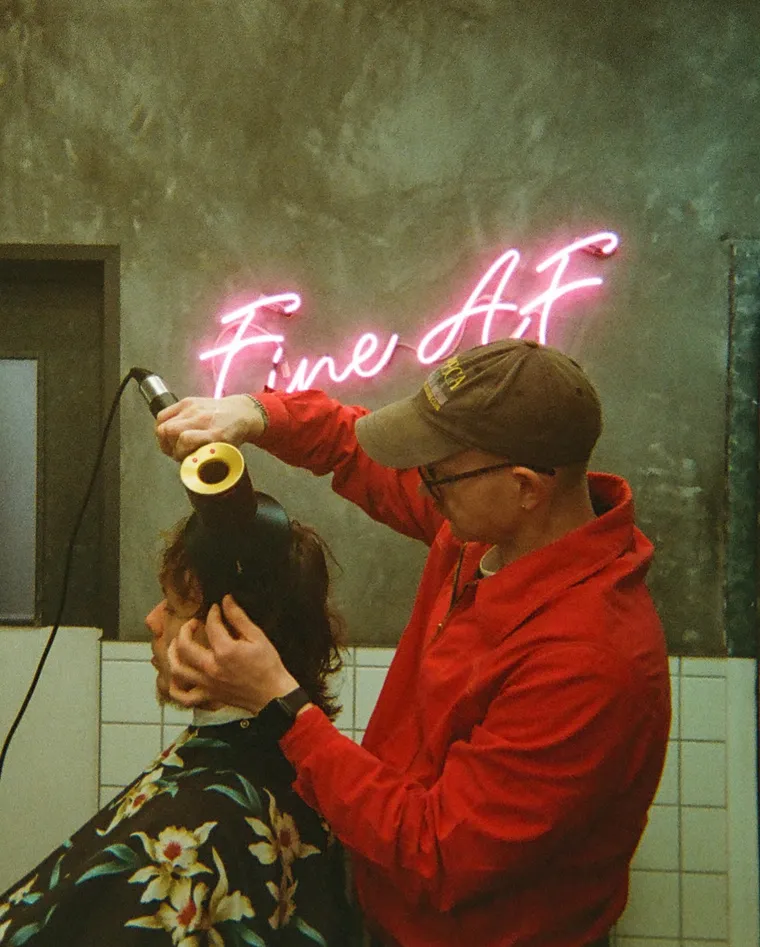 Mid-cut under the Fine AF neon